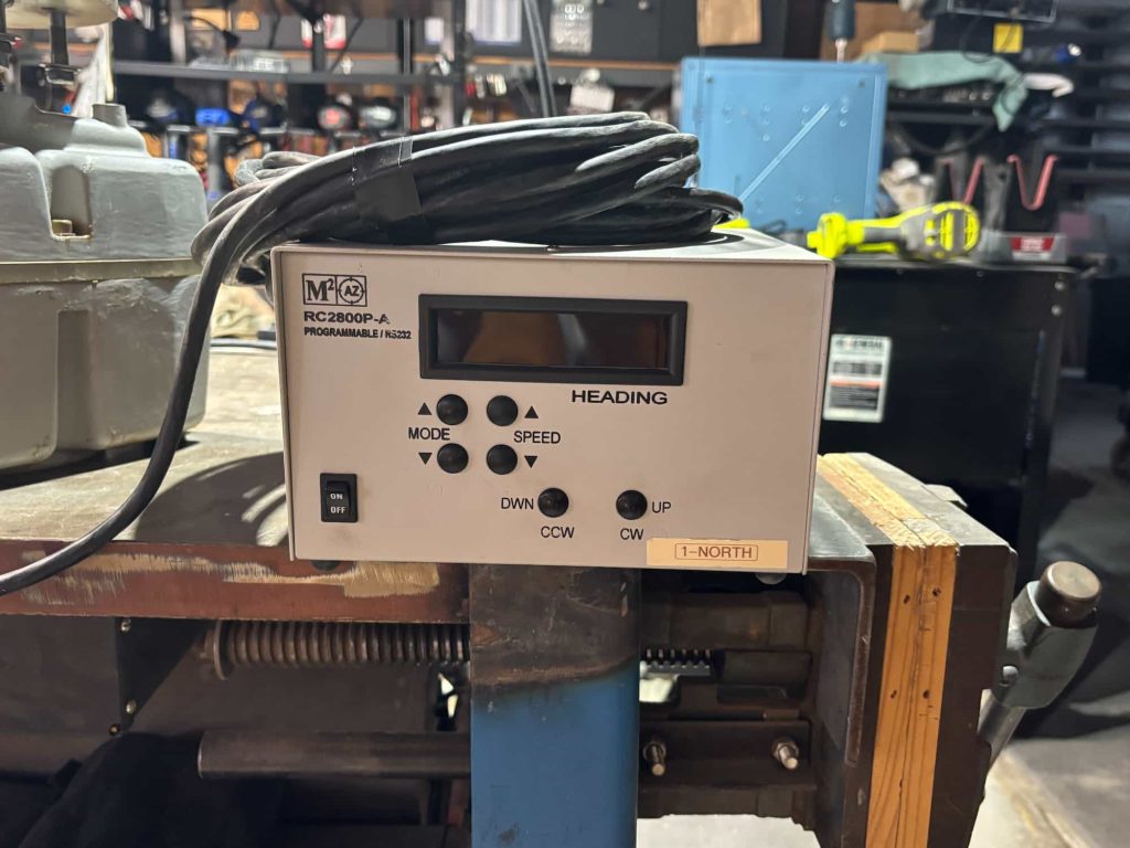 Radio control unit with switches and interface controls for antenna or station operation.